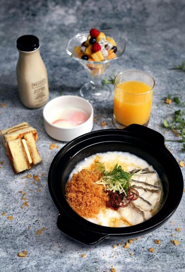 Oasia Resort Sentosa By Far East Hospitality Singapore Exterior photo A bowl of congee with preserved meat and egg